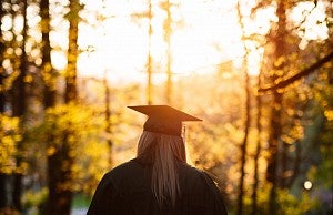 Graduate standing in trees