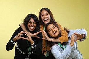 three students hugging photo studio 