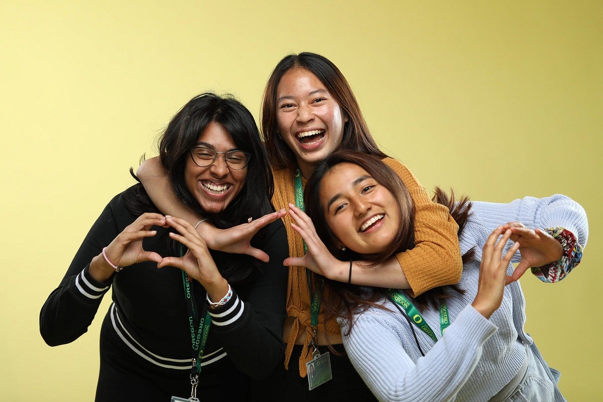 three students hugging photo studio