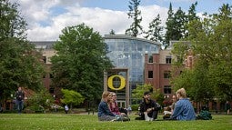 Students talking on the lawn. Students talking on the lawn.