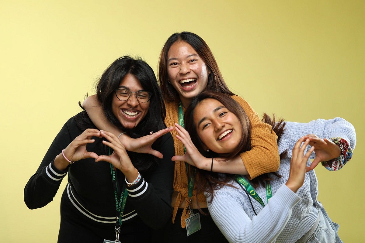 three students hugging photo studio 