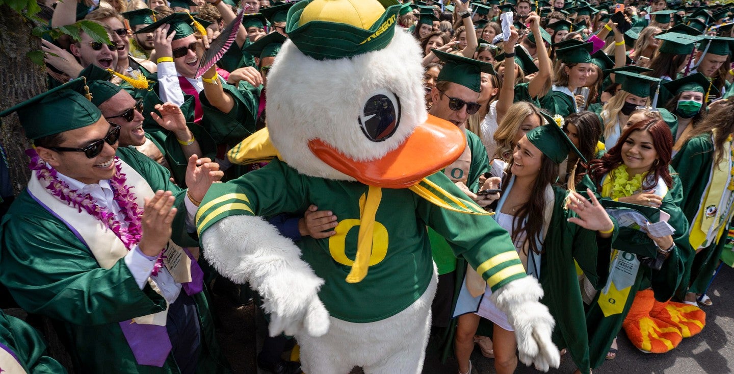 duck mascot with graduates